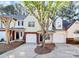 Inviting townhome featuring a brick-accented garage, manicured lawn, and welcoming curb appeal at 5953 Prescott Ct # 3105, Charlotte, NC 28269