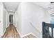 Upstairs hallway features access to bedrooms and bathrooms at 5953 Prescott Ct # 3105, Charlotte, NC 28269