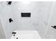 Stylish shower with marble tile and black matte fixtures at 5953 Prescott Ct # 3105, Charlotte, NC 28269
