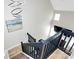 View from the top of the staircase showing a two-story ceiling and modern lighting at 5953 Prescott Ct # 3105, Charlotte, NC 28269