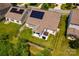 Aerial view of a home with solar panels, fenced yard, patio and hot tub at 6038 Durango Way, Denver, NC 28037