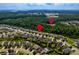 Aerial view of neighborhood, clubhouse, community pool and surrounding landscape at 6038 Durango Way, Denver, NC 28037