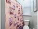 Bathroom features a lighthouse-themed shower curtain and clean white toilet at 6038 Durango Way, Denver, NC 28037