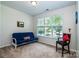Bright bedroom with large window and a futon providing comfortable seating at 6038 Durango Way, Denver, NC 28037