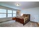 Bedroom with ample natural light from three windows and wood furnishings at 6038 Durango Way, Denver, NC 28037