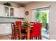 Bright dining area featuring backyard access, white cabinets, and a stylish light fixture at 6038 Durango Way, Denver, NC 28037