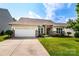Charming single-story home featuring a well-maintained lawn, two-car garage, and brick and vinyl siding at 6038 Durango Way, Denver, NC 28037