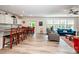 Spacious open-concept living room featuring modern light-colored vinyl floors and natural light at 6038 Durango Way, Denver, NC 28037