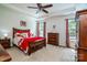 The main bedroom features a tray ceiling and ample furniture in the spacious room at 6038 Durango Way, Denver, NC 28037