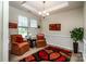 Cozy sitting room featuring two armchairs, a decorative rug and natural light at 6038 Durango Way, Denver, NC 28037