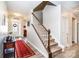 Inviting staircase leading to the upper level, complemented by a decorative red rug at 6038 Durango Way, Denver, NC 28037