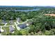 Stunning aerial view of a home with a pool in a lush, green neighborhood near a lake at 73 41St Nw Ave, Hickory, NC 28601