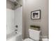 Compact bathroom featuring a shower-tub combination, with a crisp white design and modern fixtures at 73 41St Nw Ave, Hickory, NC 28601