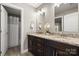 Bathroom featuring a double vanity with granite countertops and access to an adjacent shower at 73 41St Nw Ave, Hickory, NC 28601