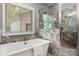 Elegant bathroom with a standalone tub, a window view, and a glass shower at 73 41St Nw Ave, Hickory, NC 28601