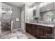 Bathroom with a double vanity, granite countertops, and a glass-enclosed shower at 73 41St Nw Ave, Hickory, NC 28601