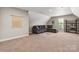 Spacious bonus room featuring comfortable seating and large windows that offer natural light at 73 41St Nw Ave, Hickory, NC 28601
