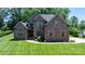 Stunning brick home with well-manicured lawn and mature trees at 73 41St Nw Ave, Hickory, NC 28601