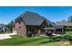 Lovely brick home exterior featuring a well-manicured lawn, patio, and gazebo at 73 41St Nw Ave, Hickory, NC 28601