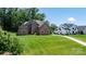 Beautiful brick home with a spacious front yard and lush greenery at 73 41St Nw Ave, Hickory, NC 28601