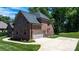 Brick home exterior with a two-car garage, well-maintained lawn, and manicured landscaping at 73 41St Nw Ave, Hickory, NC 28601