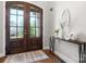Elegant foyer with glass double doors, hardwood floors, and stylish decor at 73 41St Nw Ave, Hickory, NC 28601