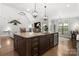 Open-concept kitchen boasts a large island with granite countertops and modern lighting at 73 41St Nw Ave, Hickory, NC 28601