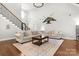 Bright living room with vaulted ceiling, decor, and hardwood floors at 73 41St Nw Ave, Hickory, NC 28601