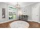 Versatile room with bar area, hardwood floors, and stylish chandelier at 73 41St Nw Ave, Hickory, NC 28601
