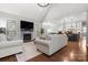 Cozy living room featuring a fireplace, large windows, and hardwood floors at 73 41St Nw Ave, Hickory, NC 28601