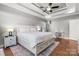 Serene main bedroom with coffered ceilings, a ceiling fan, and hardwood floors at 73 41St Nw Ave, Hickory, NC 28601