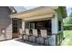 Inviting outdoor bar area with barstool seating and a wood paneled back wall with a tv at 73 41St Nw Ave, Hickory, NC 28601