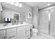 Modern bathroom with double vanity, and a glass-enclosed shower showcasing contemporary design at 7335 Childress Dr, Concord, NC 28025