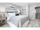 Comfortable bedroom with neutral walls, carpet, and classic white headboard at 7335 Childress Dr, Concord, NC 28025