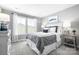 Cozy bedroom featuring a bed with white headboard, soft carpet, and natural light at 7335 Childress Dr, Concord, NC 28025