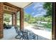 Brick covered patio with outdoor seating offers a comfortable and shaded spot to enjoy the backyard at 7545 Rabbit Cir, Denver, NC 28037