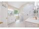 Modern bathroom with marble walk-in shower, dual vanities, and stylish fixtures at 7545 Rabbit Cir, Denver, NC 28037