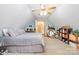 Large bedroom under the roof with blue walls offers ample space and natural light at 7545 Rabbit Cir, Denver, NC 28037