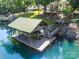 Lakeside boat dock with covered slip, wooden walkway, and easy access to the water at 7545 Rabbit Cir, Denver, NC 28037