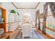 Formal dining room with wood trim, elegant chandelier, and a decorative rug at 7545 Rabbit Cir, Denver, NC 28037