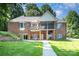 Spacious brick home with a walkout basement, balcony, and a backyard patio for outdoor enjoyment at 7545 Rabbit Cir, Denver, NC 28037