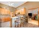 View of the kitchen with granite countertops, stainless steel appliances, and barstool seating at 7545 Rabbit Cir, Denver, NC 28037