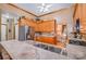Kitchen featuring stainless appliances, wooden cabinetry and travertine tile flooring at 7545 Rabbit Cir, Denver, NC 28037