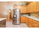 Kitchen featuring stainless steel appliances, wood cabinets, and tile backsplash at 7545 Rabbit Cir, Denver, NC 28037