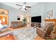 Spacious living room with vaulted ceilings, a ceiling fan, hardwood floors and a decorative rug at 7545 Rabbit Cir, Denver, NC 28037