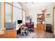 Bright home office featuring large windows, vaulted ceiling, and wood flooring at 7545 Rabbit Cir, Denver, NC 28037