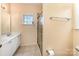 Bathroom with a walk-in shower, double sink vanity, and neutral tile flooring at 7642 Rolling Meadows Ln, Huntersville, NC 28078