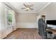 Bright and spacious office with hardwood floors, large window, and elegant trim work at 7642 Rolling Meadows Ln, Huntersville, NC 28078