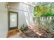 Inviting entryway with a shaded porch, charming decor, and a welcoming doormat, creating a warm entrance at 7900 Horse Chestnut Ln, Charlotte, NC 28277