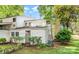 Charming white two-story home with a manicured lawn and lush landscaping at 7900 Horse Chestnut Ln, Charlotte, NC 28277
